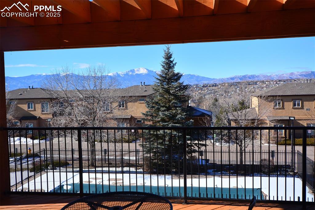 6967 Stetson Ranch Point, Unit 105 Colorado Springs, CO 80922 - Photo 29 of 37 a view of a balcony with a yard
