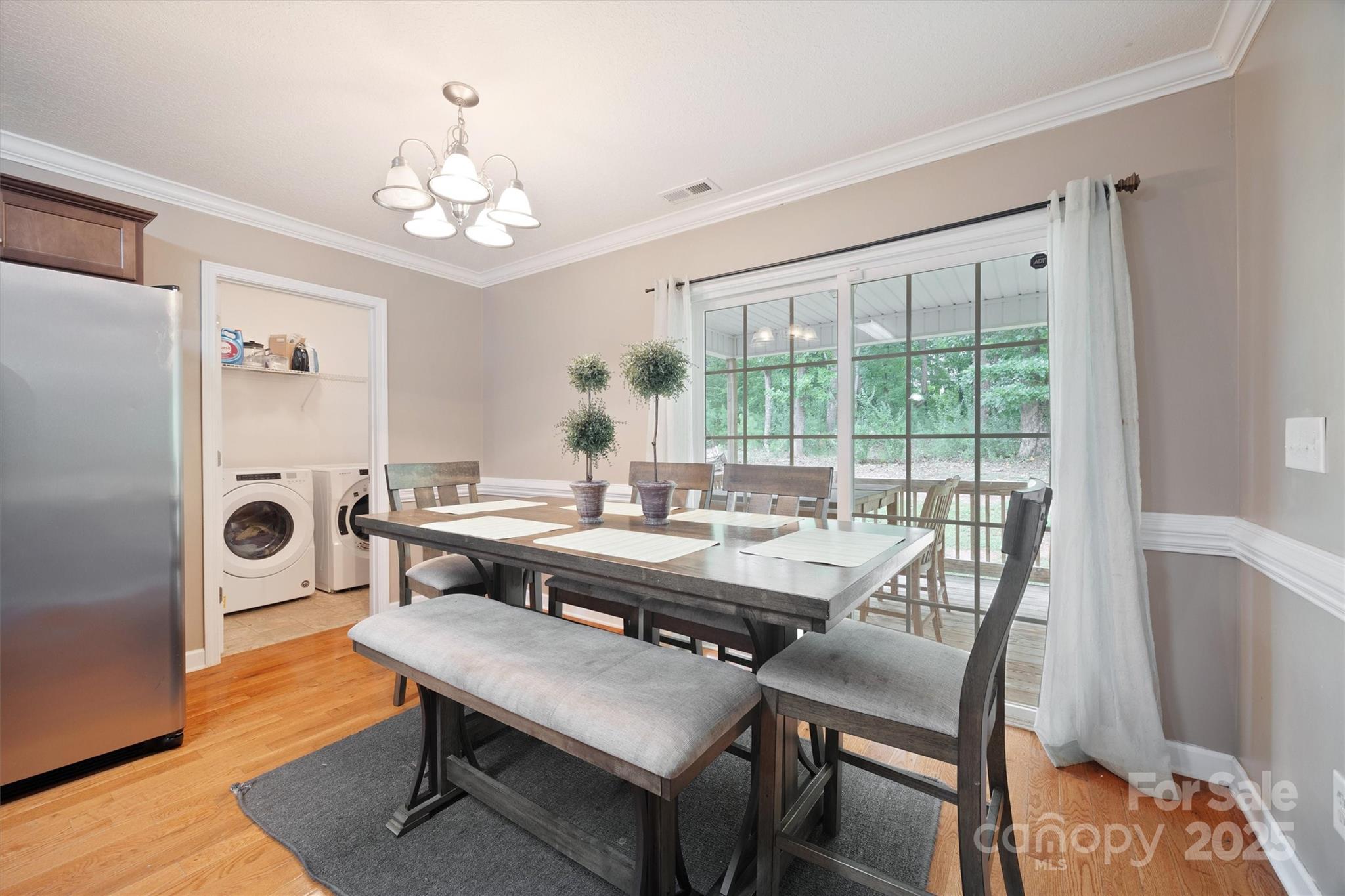 587 Kelly Road York, SC 29745 - Photo 13 of 28 a view of a dining room with furniture window and wooden floor