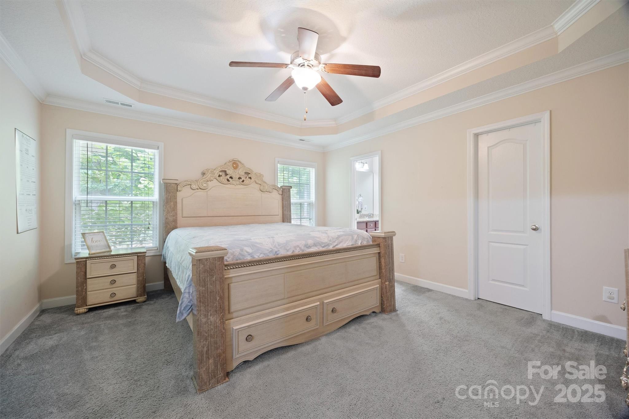 587 Kelly Road York, SC 29745 - Photo 20 of 28 a bedroom with a bed and a chandelier