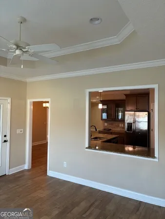 a view of empty room with window and fireplace