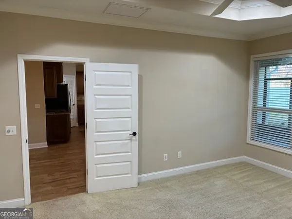 a view of an empty room with a window