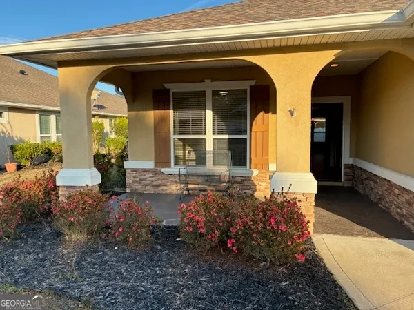 a front view of a house with a porch