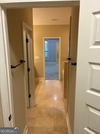 a white toilet sitting next to a shower