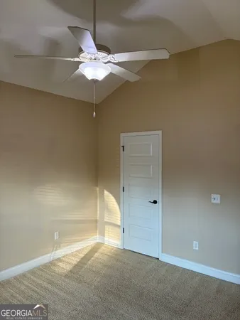 a bathroom with a shower curtain and a sink