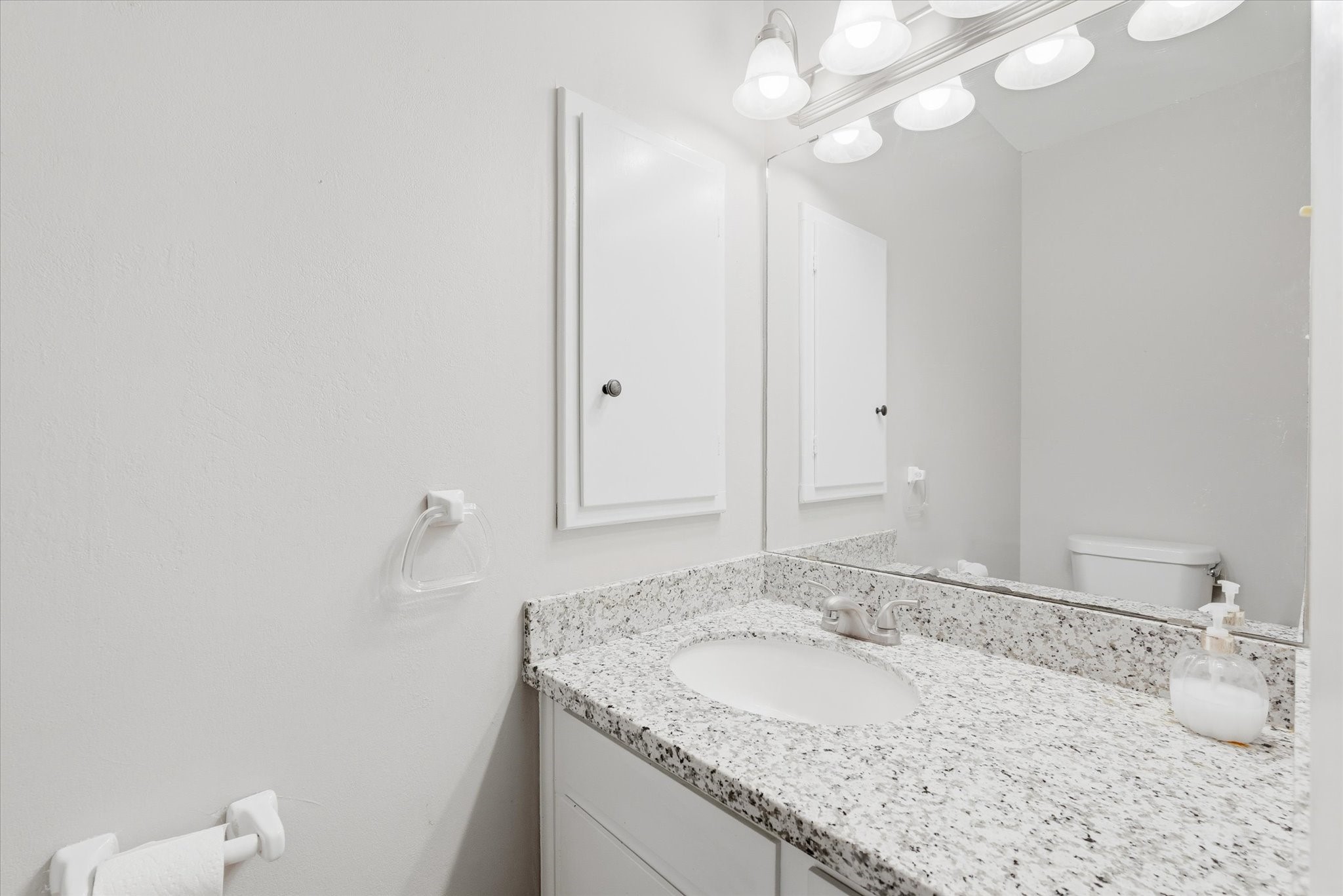 6004 Lakeside Drive Liberty, TX 77575 - Photo 12 of 28 a bathroom with a granite countertop sink and a mirror
