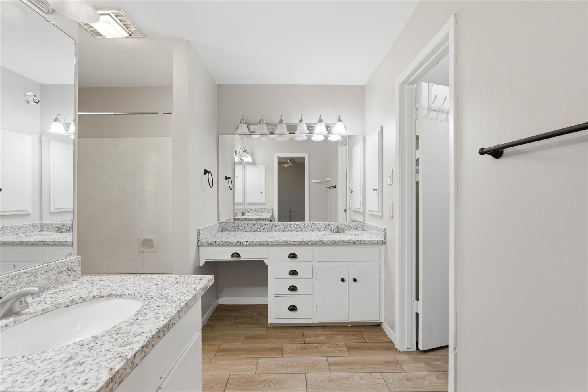6004 Lakeside Drive Liberty, TX 77575 - Photo 16 of 28 a bathroom with a granite countertop sink a mirror and a shower