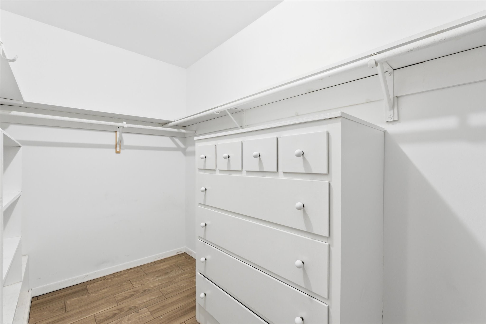 6004 Lakeside Drive Liberty, TX 77575 - Photo 19 of 28 a view of white cabinets and wooden floor