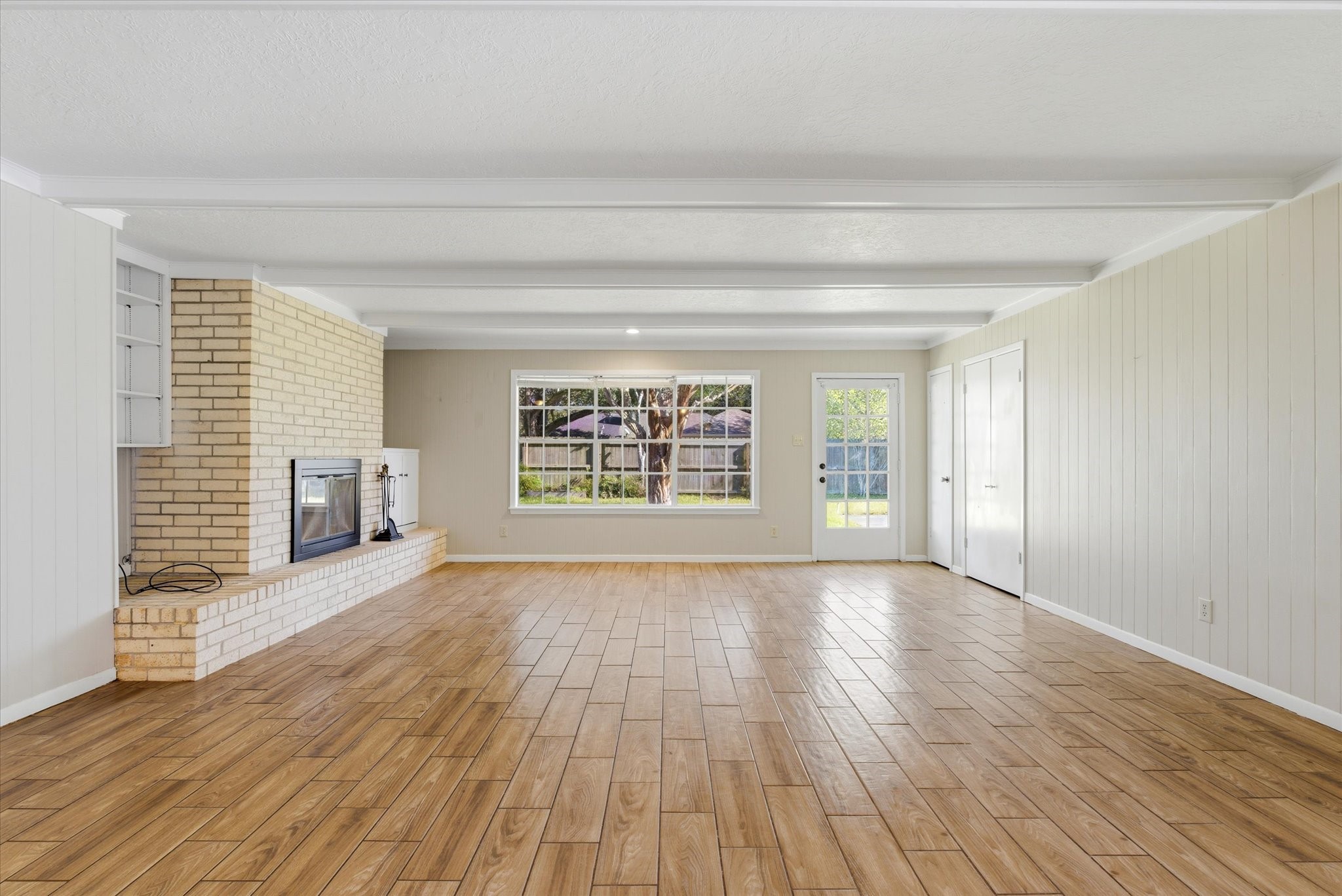6004 Lakeside Drive Liberty, TX 77575 - Photo 3 of 28 a view of an empty room with wooden floor and a window