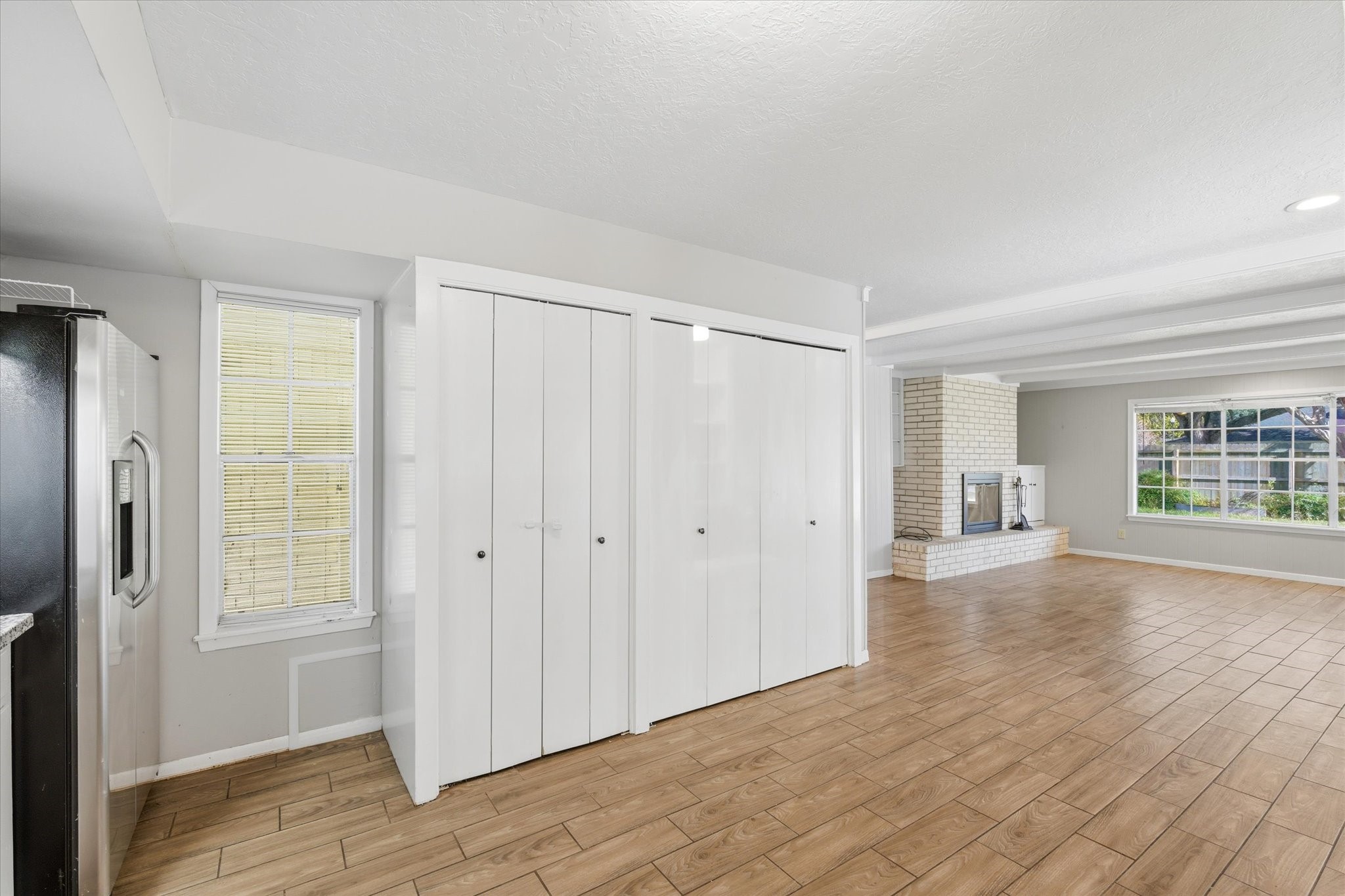 6004 Lakeside Drive Liberty, TX 77575 - Photo 8 of 28 a view of an empty room with wooden floor and a window