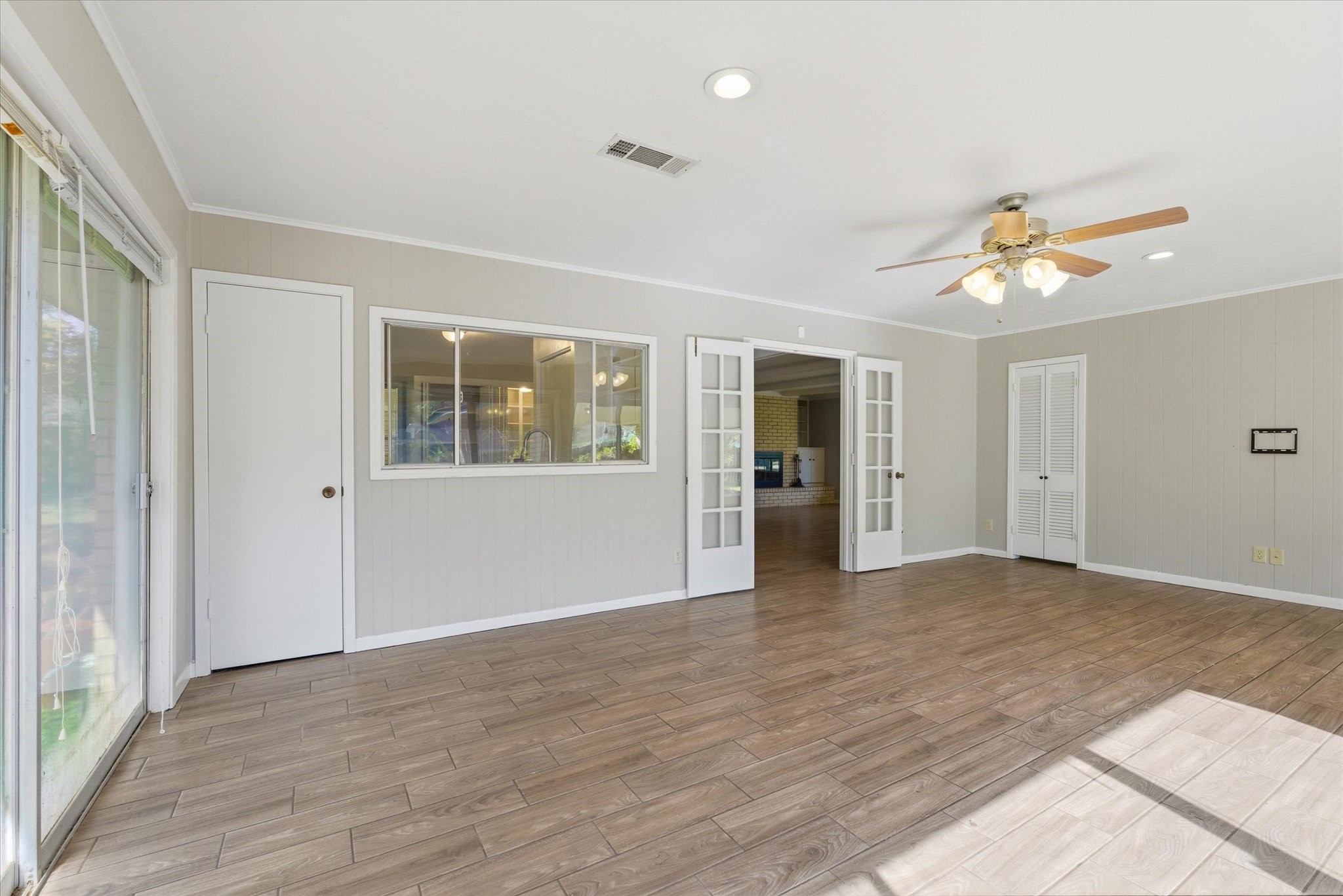 6004 Lakeside Drive Liberty, TX 77575 - Photo 10 of 28 wooden floor in an empty room with a window