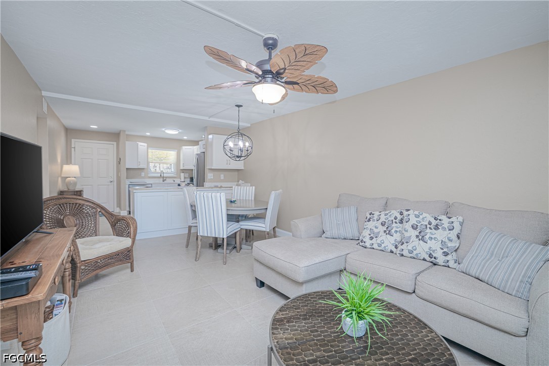 16007 Davis Road, Unit 713 Fort Myers, FL 33908 - Photo 11 of 41 a living room with furniture and a flat screen tv