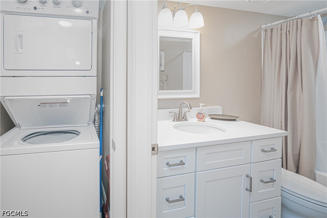 16007 Davis Road, Unit 713 Fort Myers, FL 33908 - Photo 13 of 41 a utility room with dryer and washer