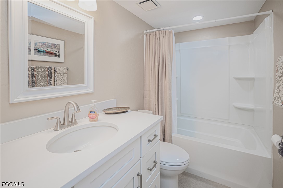 16007 Davis Road, Unit 713 Fort Myers, FL 33908 - Photo 14 of 41 a bathroom with a sink toilet and shower