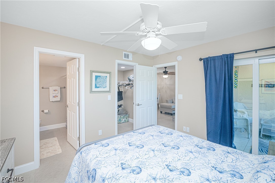 16007 Davis Road, Unit 713 Fort Myers, FL 33908 - Photo 21 of 41 a bedroom with a bed and a dresser