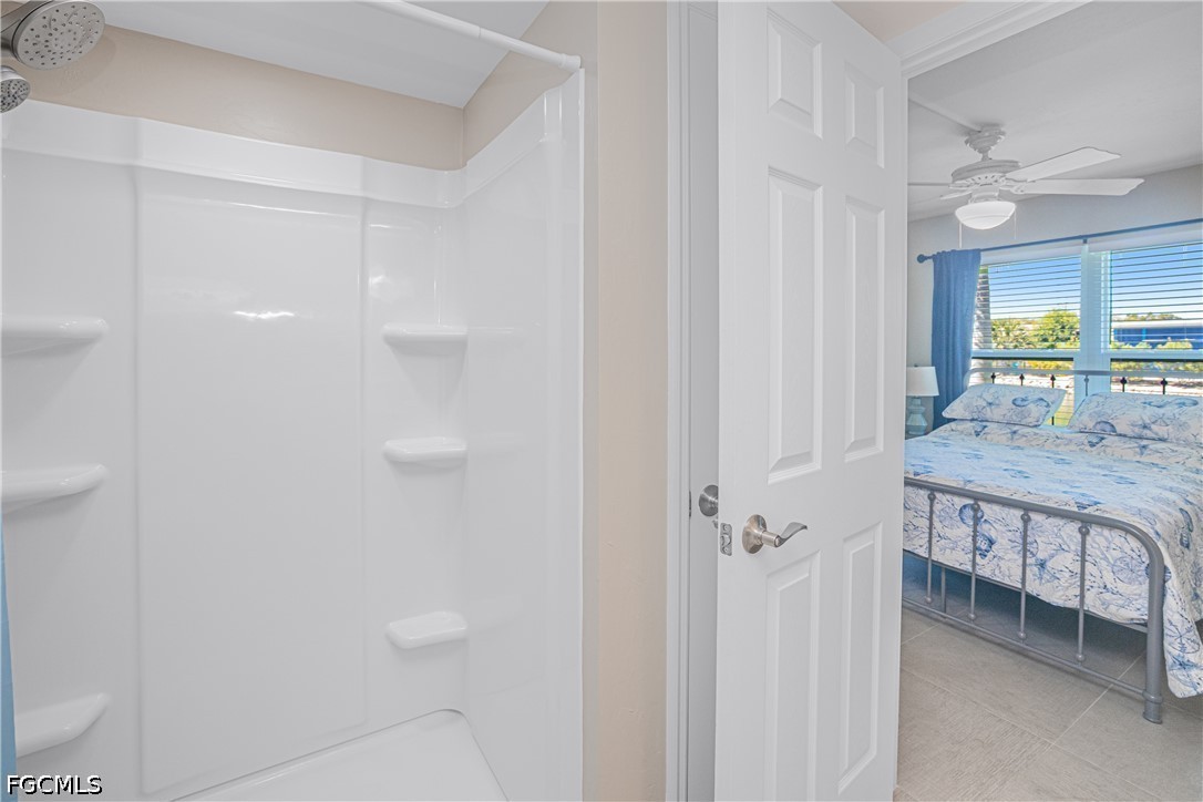 16007 Davis Road, Unit 713 Fort Myers, FL 33908 - Photo 23 of 41 a bathroom with a granite countertop sink and a mirror