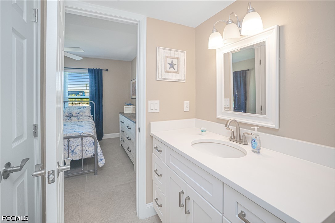 16007 Davis Road, Unit 713 Fort Myers, FL 33908 - Photo 24 of 41 a en suite bathroom with a sink and a mirror