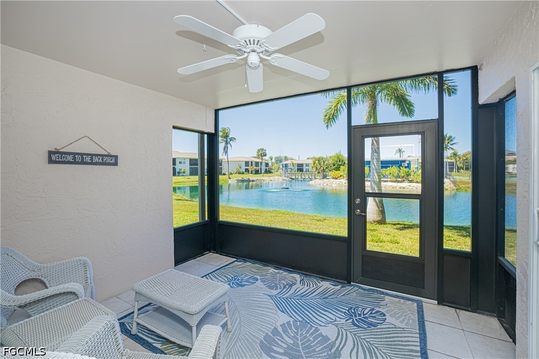 16007 Davis Road, Unit 713 Fort Myers, FL 33908 - Photo 26 of 41 a bedroom with a bed and large window