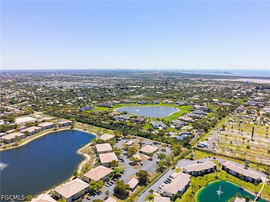 16007 Davis Road, Unit 713 Fort Myers, FL 33908 - Photo 41 of 41 an aerial view of residential houses with outdoor space