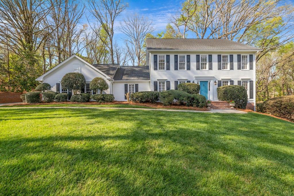 7650 Ryefield Drive Sandy Springs, GA 30350 - Photo 1 of 38 a front view of a house with a yard