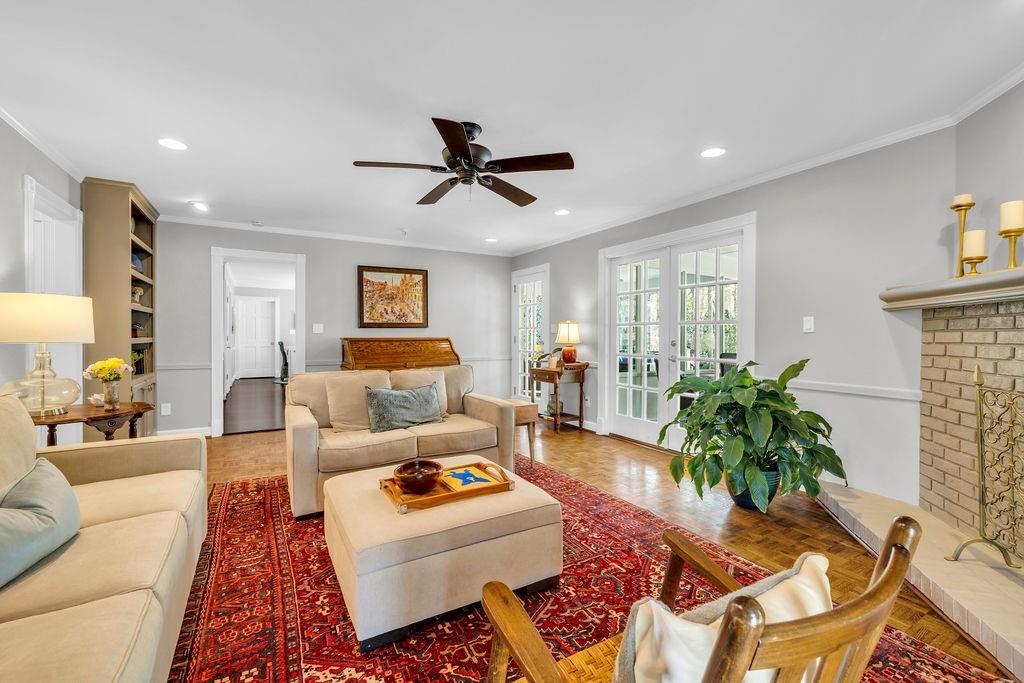 7650 Ryefield Drive Sandy Springs, GA 30350 - Photo 11 of 38 a living room with furniture and a potted plant