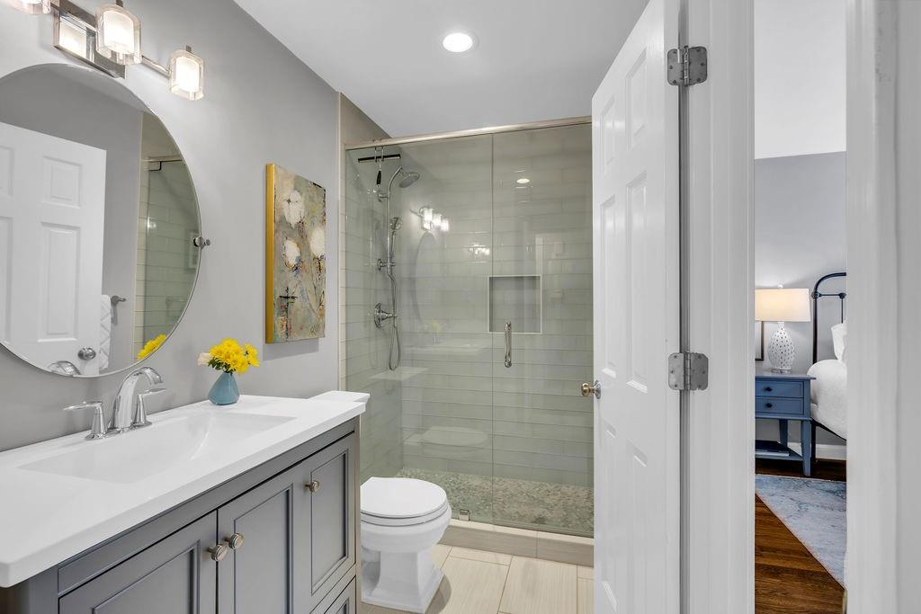 7650 Ryefield Drive Sandy Springs, GA 30350 - Photo 18 of 38 a bathroom with a sink toilet and shower