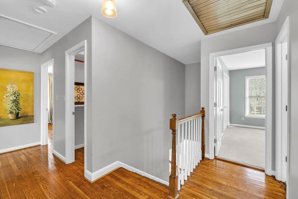 7650 Ryefield Drive Sandy Springs, GA 30350 - Photo 20 of 38 a view of a hallway with wooden floor and closet