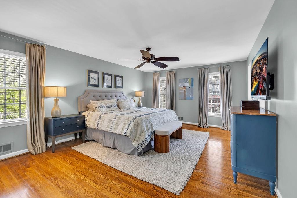 7650 Ryefield Drive Sandy Springs, GA 30350 - Photo 21 of 38 a spacious bedroom with a bed and a dresser