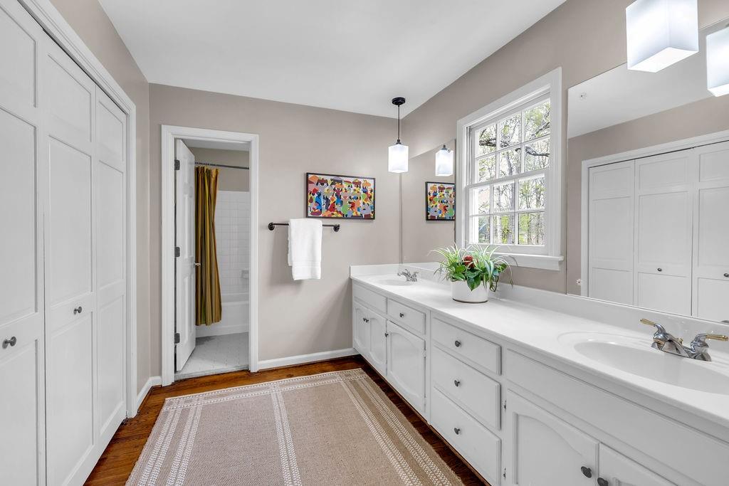 7650 Ryefield Drive Sandy Springs, GA 30350 - Photo 22 of 38 a spacious bathroom with a double vanity sink and a mirror