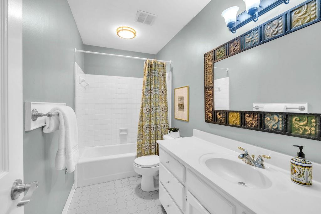 7650 Ryefield Drive Sandy Springs, GA 30350 - Photo 25 of 38 a bathroom with a sink a toilet and shower