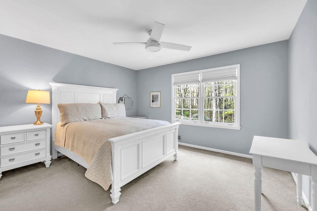 7650 Ryefield Drive Sandy Springs, GA 30350 - Photo 26 of 38 a bedroom with a bed and a window