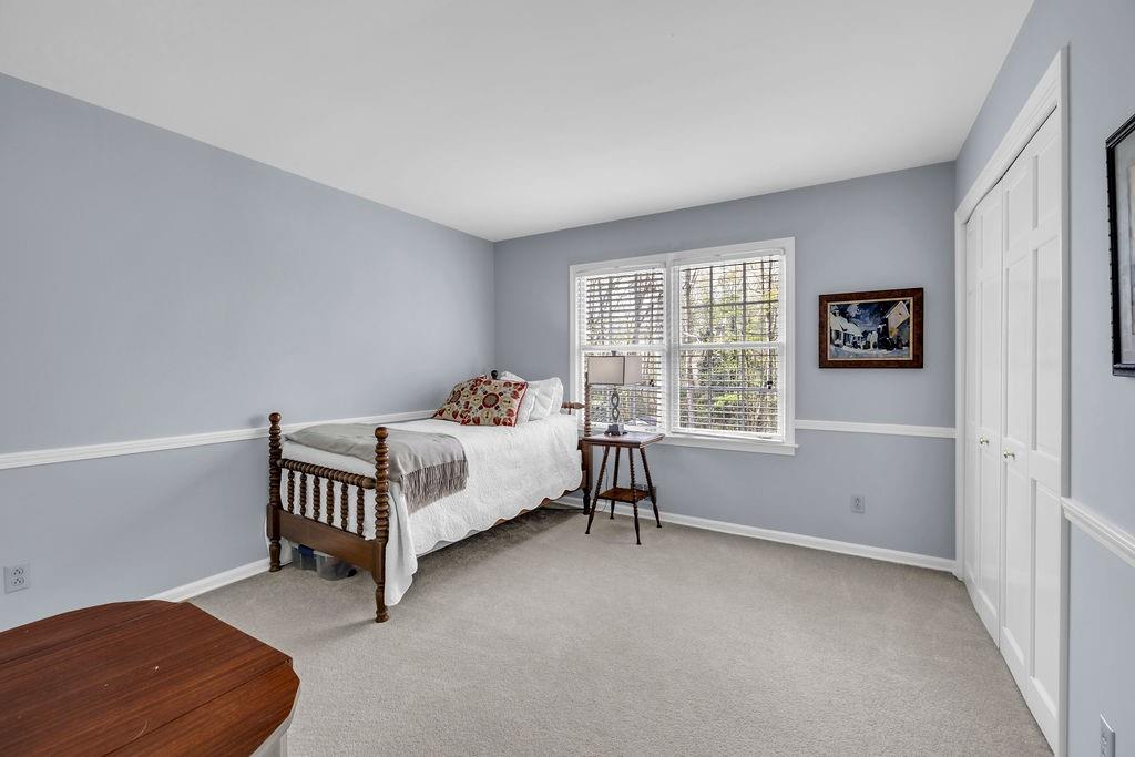 7650 Ryefield Drive Sandy Springs, GA 30350 - Photo 27 of 38 a bedroom with a bed and a window