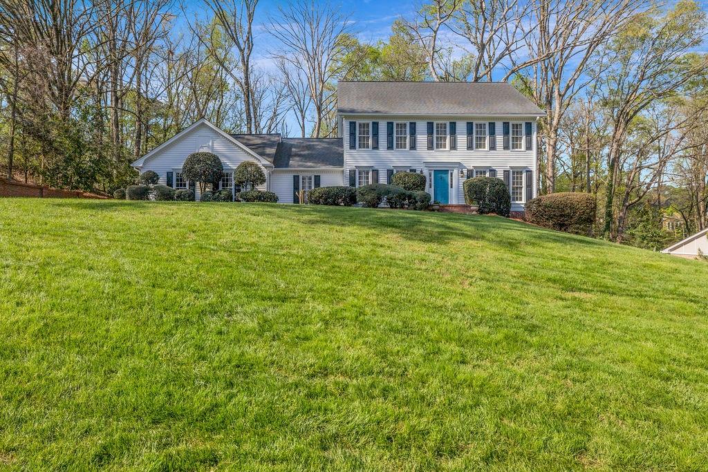 7650 Ryefield Drive Sandy Springs, GA 30350 - Photo 37 of 38 a view of house with garden and tall trees