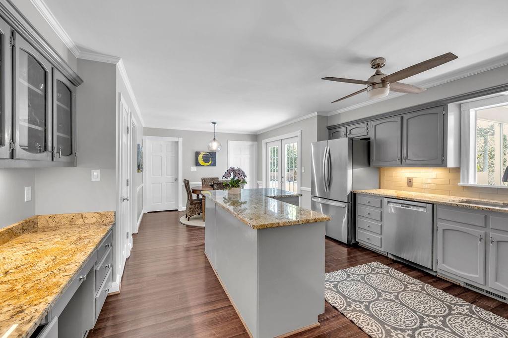 7650 Ryefield Drive Sandy Springs, GA 30350 - Photo 6 of 38 a kitchen with counter top space cabinets appliances and windows