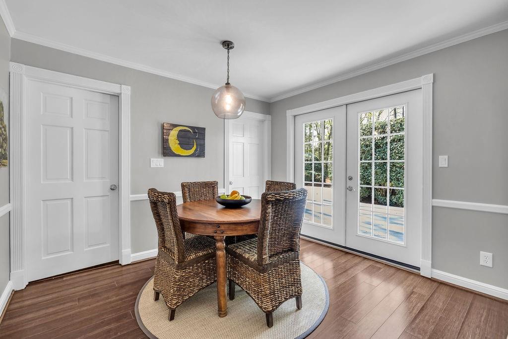 7650 Ryefield Drive Sandy Springs, GA 30350 - Photo 9 of 38 a view of a dining room with furniture wooden floor and chandelier