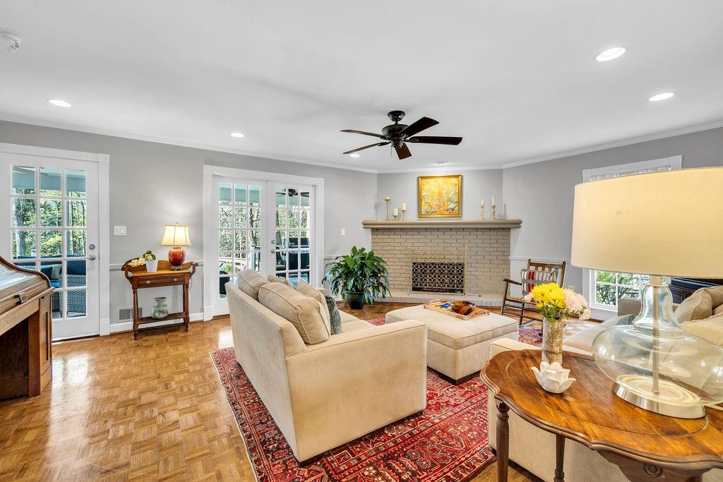 7650 Ryefield Drive Sandy Springs, GA 30350 - Photo 10 of 38 a living room with fireplace furniture and a flat screen tv