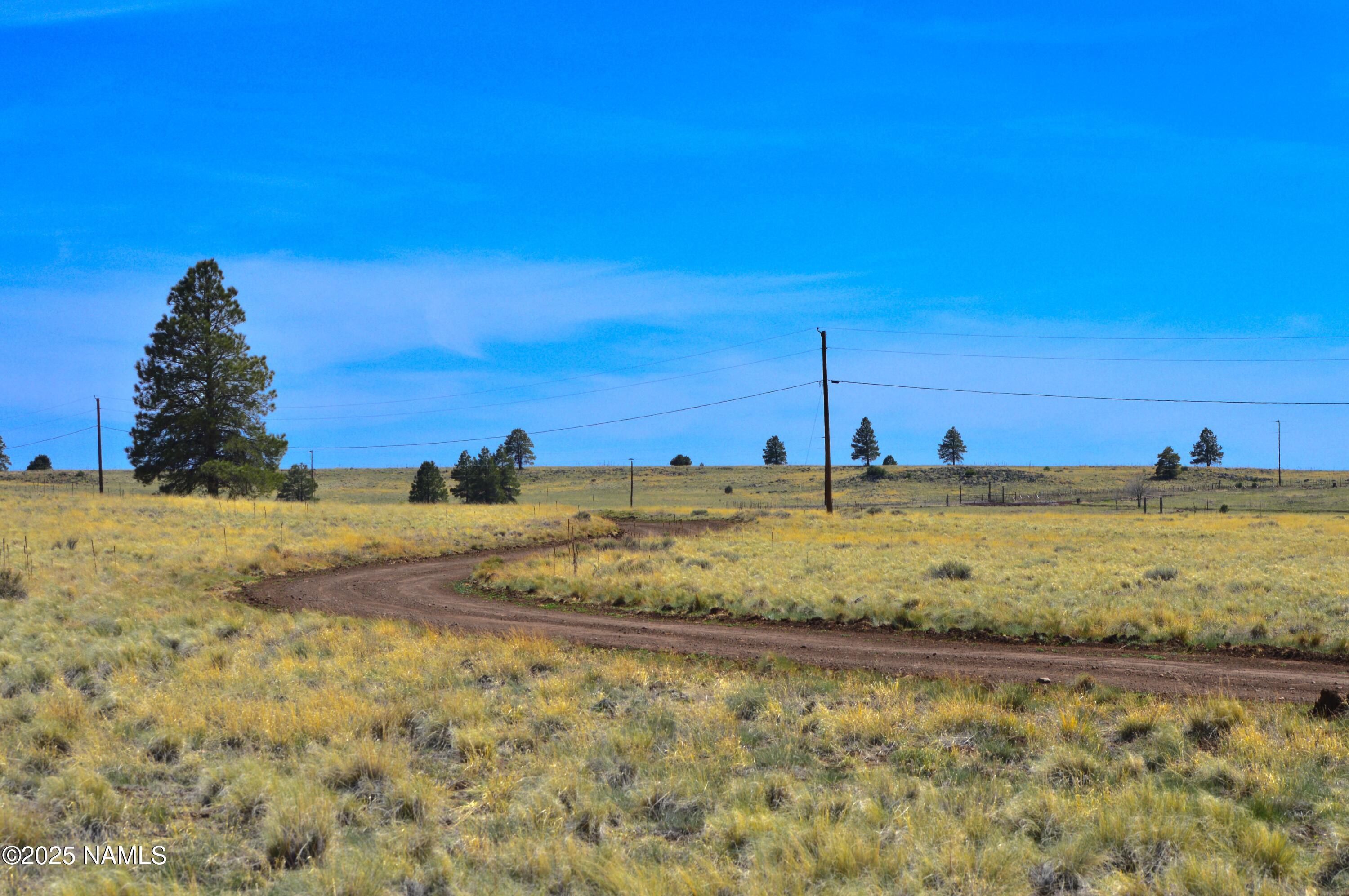a view of a large body of water with a building in the background