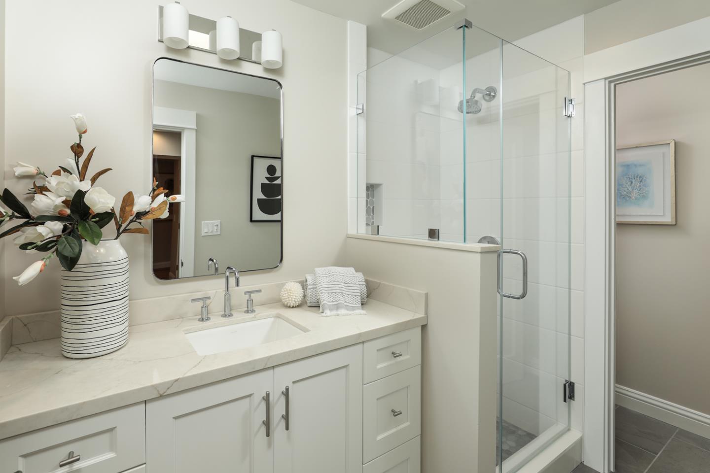 153 Stone Pine Lane Menlo Park, CA 94025 - Photo 19 of 31 a bathroom with a sink a mirror and a shower