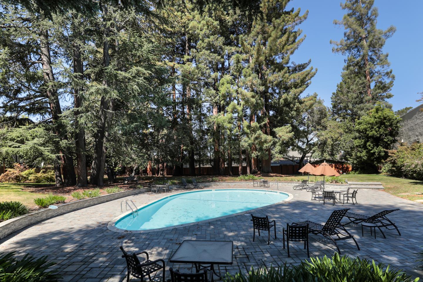 153 Stone Pine Lane Menlo Park, CA 94025 - Photo 26 of 31 an outdoor space with seating area and trees