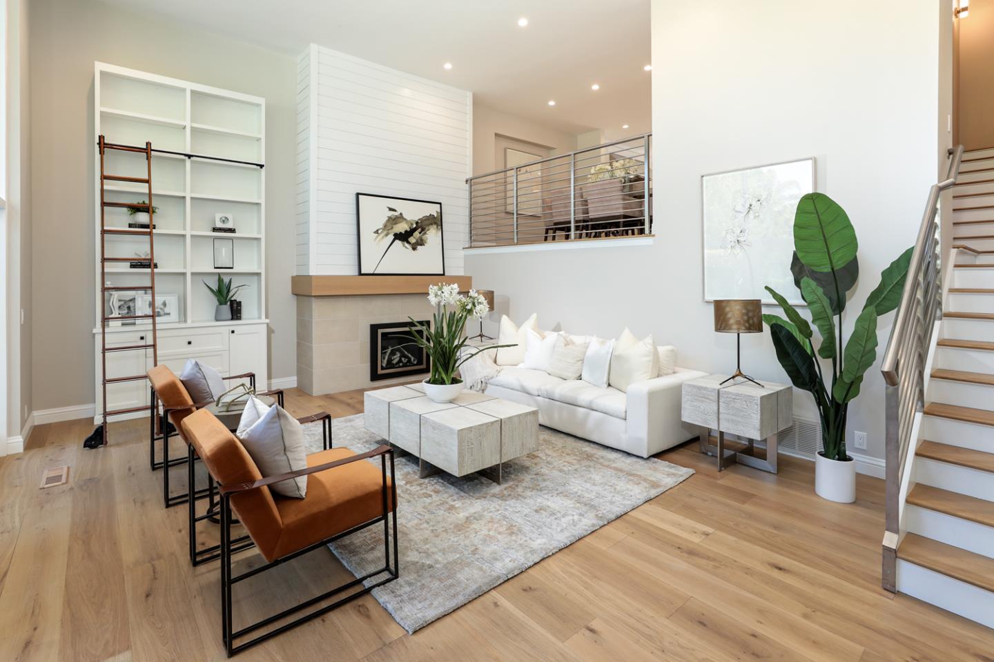 153 Stone Pine Lane Menlo Park, CA 94025 - Photo 4 of 31 a living room with furniture a fireplace and a potted plant