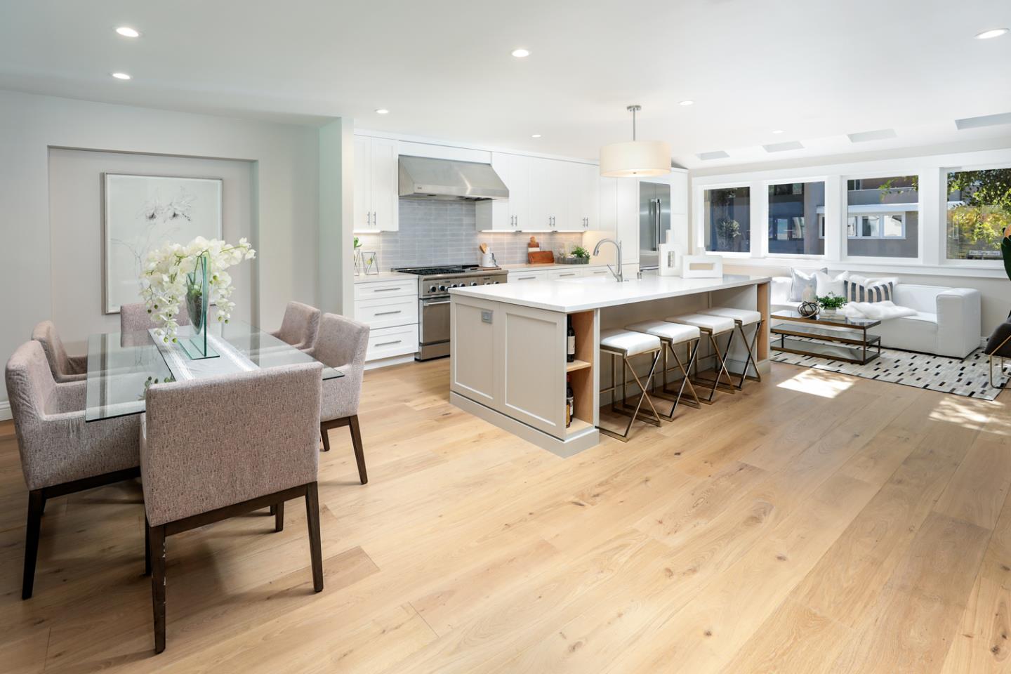 153 Stone Pine Lane Menlo Park, CA 94025 - Photo 5 of 31 a living room with furniture a dining table wooden floor and a kitchen view