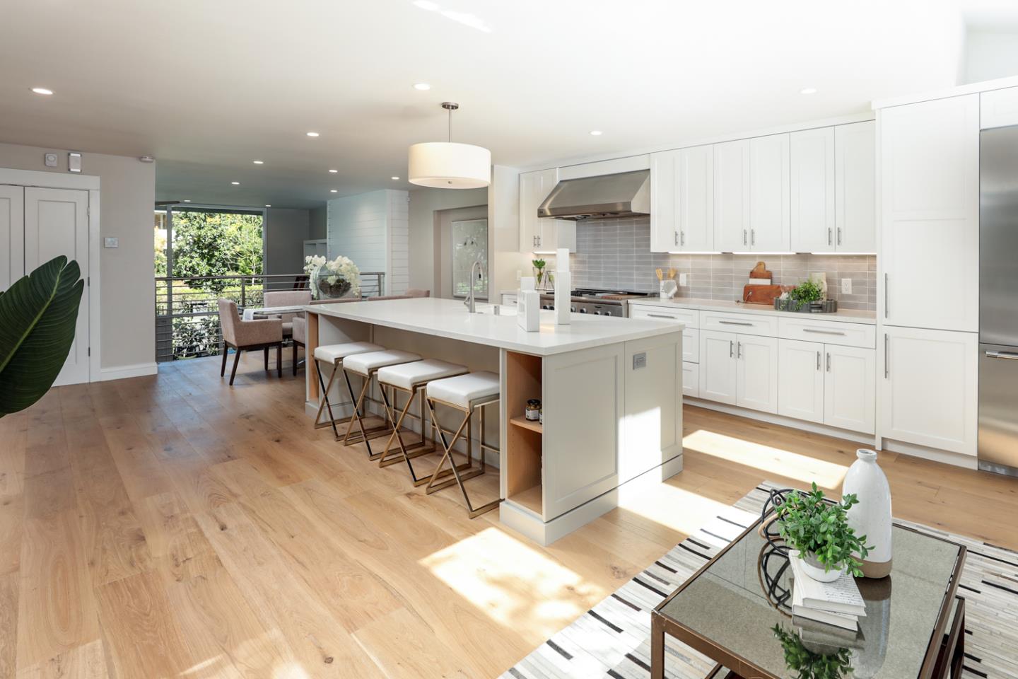153 Stone Pine Lane Menlo Park, CA 94025 - Photo 8 of 31 a large kitchen with kitchen island a sink table and chairs