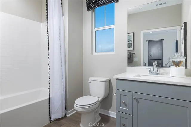 a bathroom with a toilet a sink and a bathtub