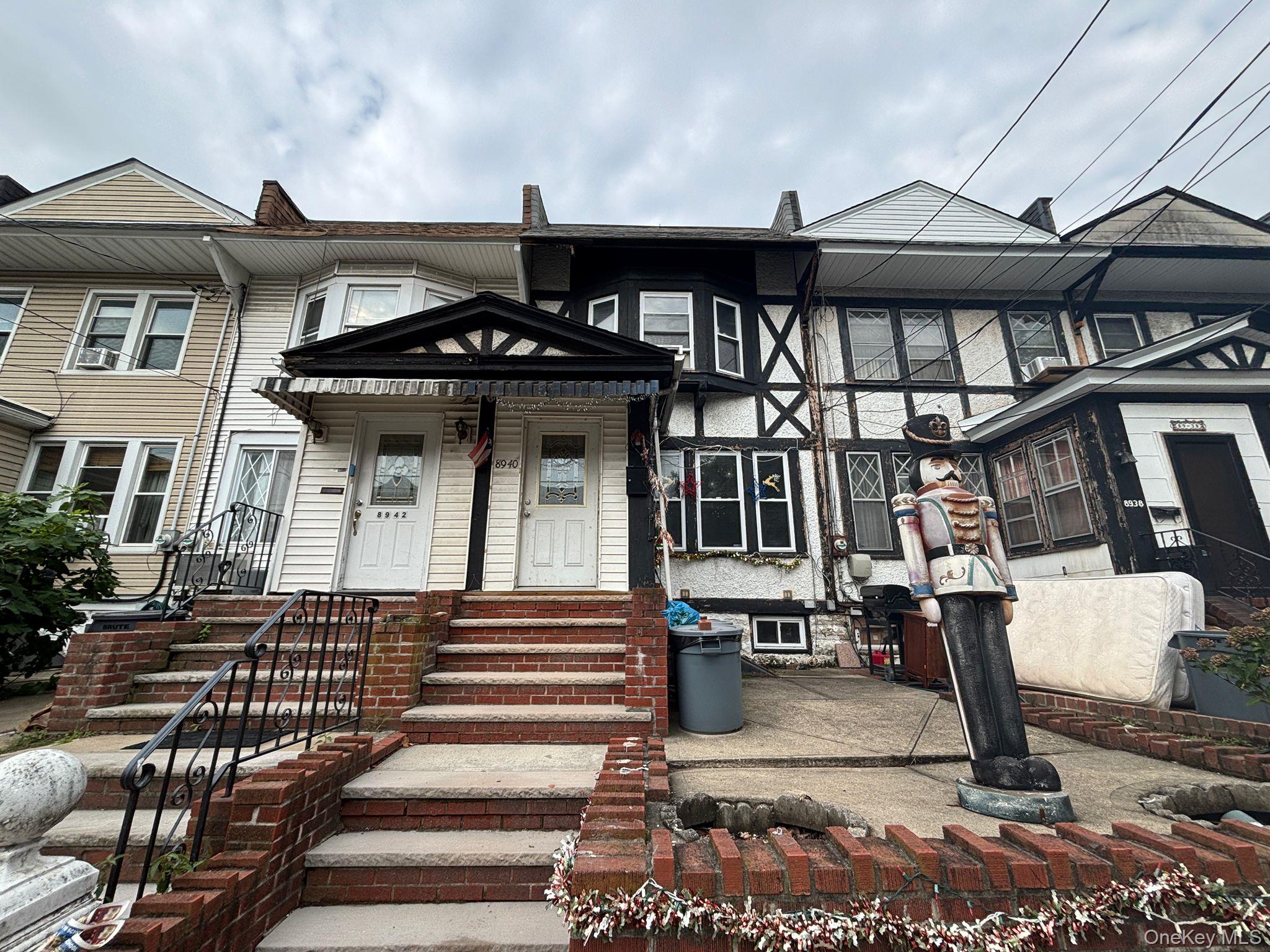 89-40 88th Street Queens, NY 11421 - Photo 1 of 2 a front view of a house with a porch