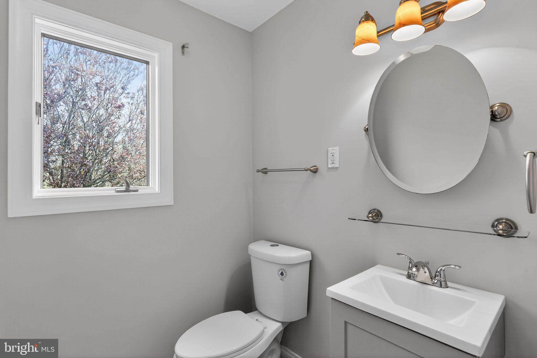 26 Sunset Road Royersford, PA 19468 - Photo 11 of 30 a bathroom with a toilet sink and mirror