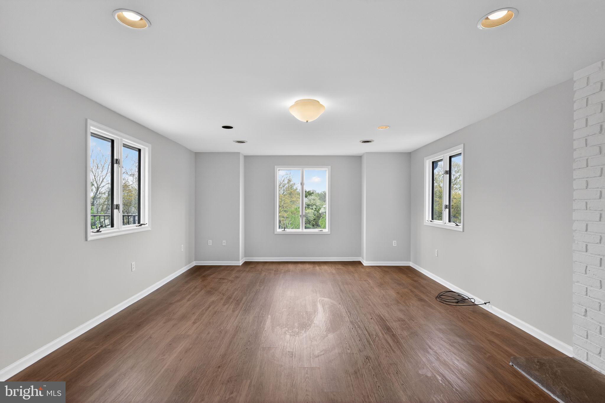 26 Sunset Road Royersford, PA 19468 - Photo 15 of 30 a view of an empty room with wooden floor and a window