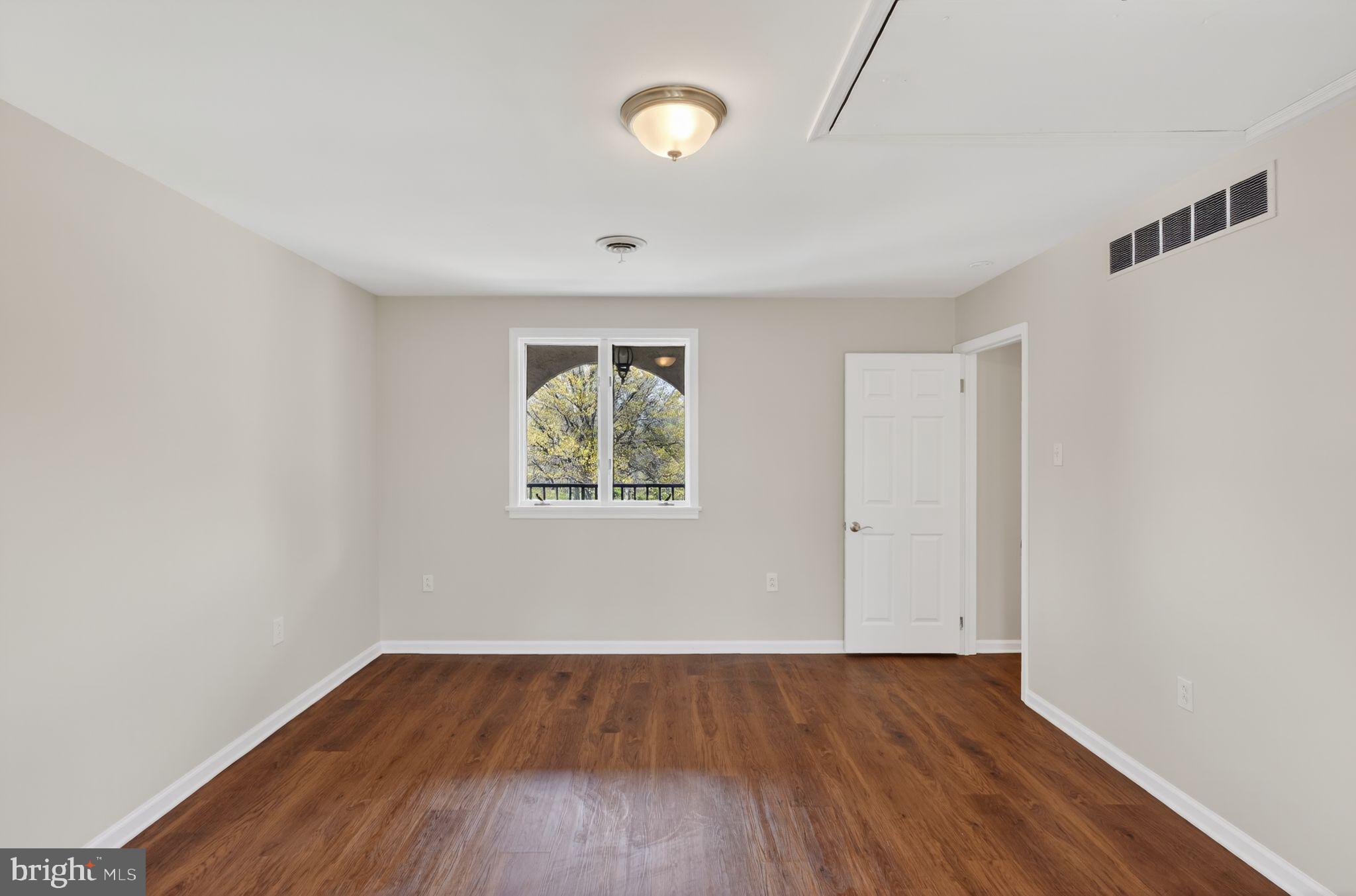 26 Sunset Road Royersford, PA 19468 - Photo 17 of 30 an empty room with wooden floor and windows