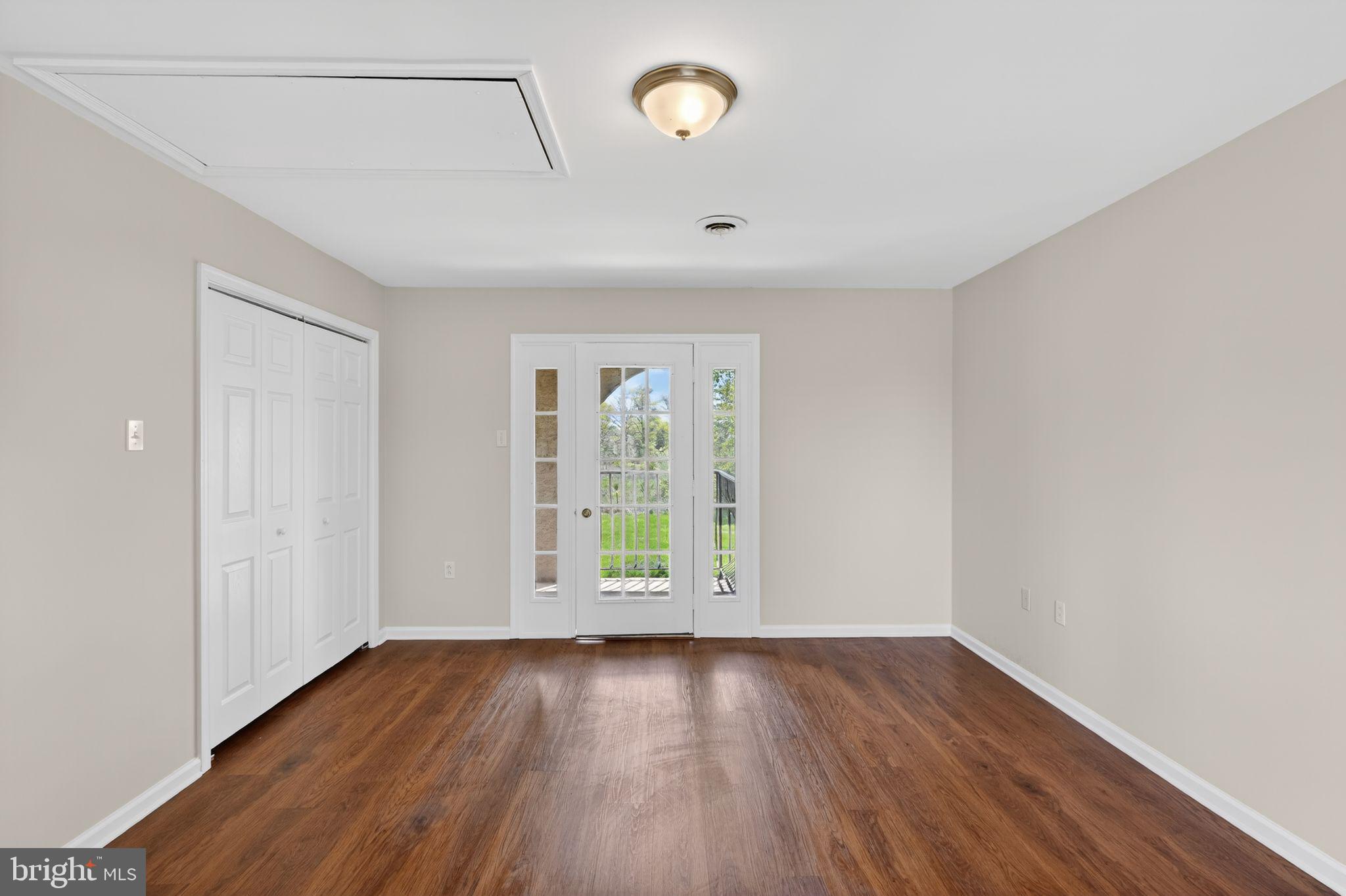 26 Sunset Road Royersford, PA 19468 - Photo 19 of 30 an empty room with wooden floor and windows