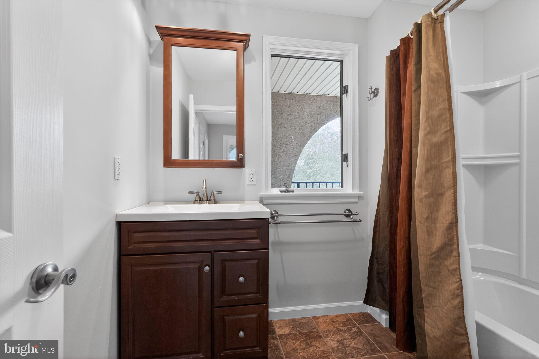 26 Sunset Road Royersford, PA 19468 - Photo 20 of 30 a bathroom with a sink vanity and a mirror