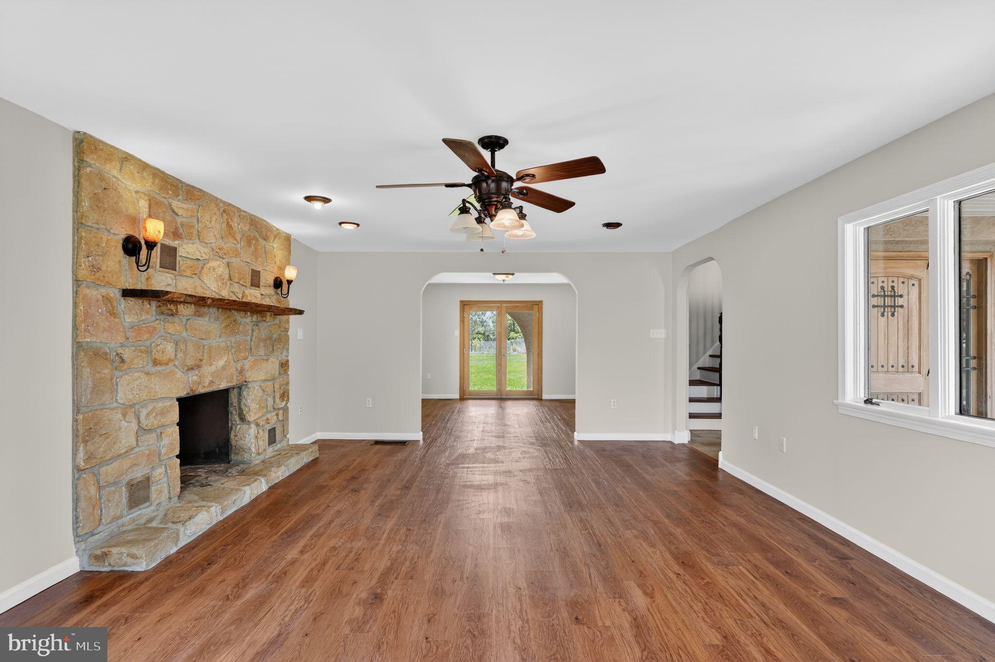 26 Sunset Road Royersford, PA 19468 - Photo 4 of 30 a view of empty room with wooden floor and fireplace
