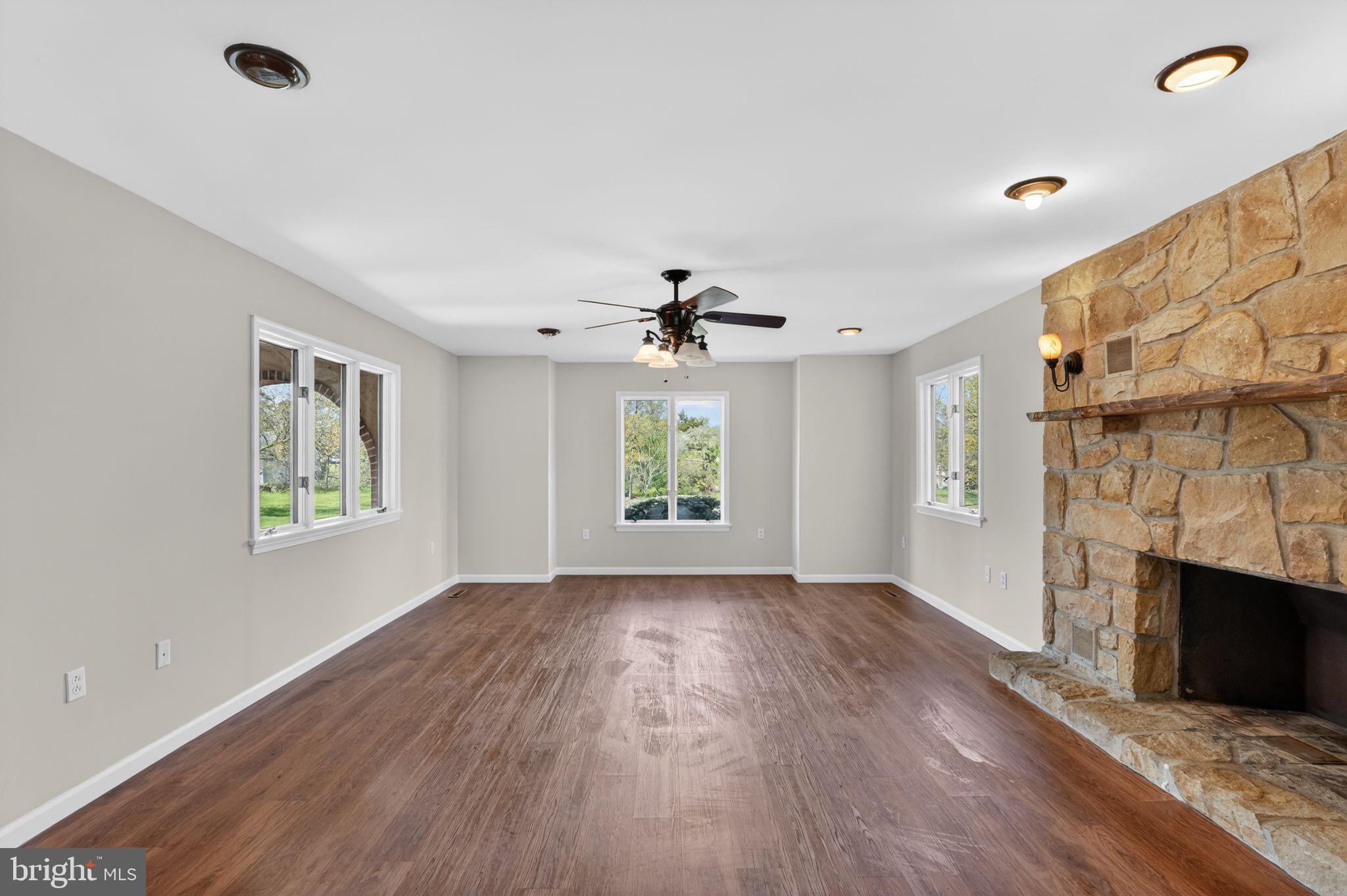 26 Sunset Road Royersford, PA 19468 - Photo 6 of 30 a view of livingroom with window fireplace and wooden floor